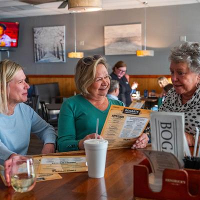 Customers browsing the menu.