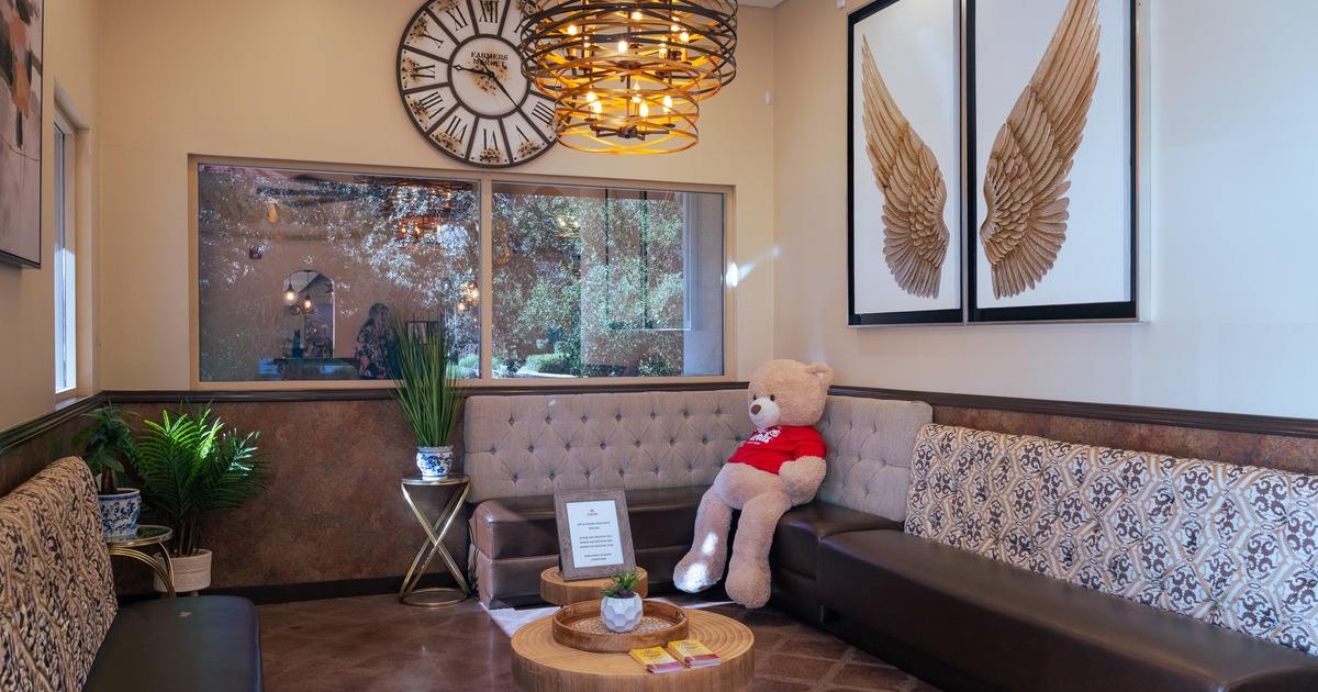 Lounge area with a Teddy bear on the sofa