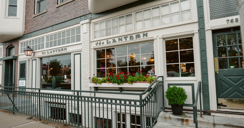 Exterior, side walk, front view to restaurant porch and entrance
