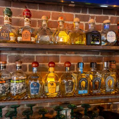 Various tequila bottles at the bar