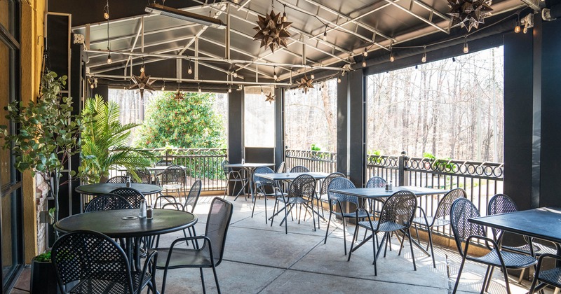 Exterior, patio, covered seating area, tables with chairs for three and four people