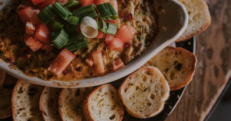Cheese dip dish with crostini bread