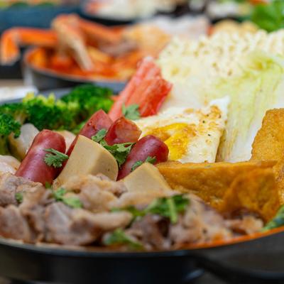 Tomato Soup Bowl topped with various ingredients.