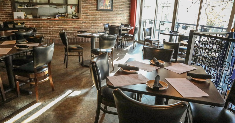 Nicely done interior dining area with set tables