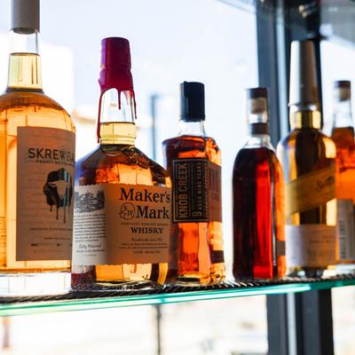 Assorted bottles of whiskey.