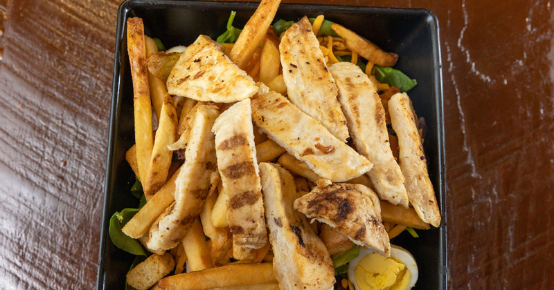 Grilled chicken with green peppers, onions, egg, cheddar and fries