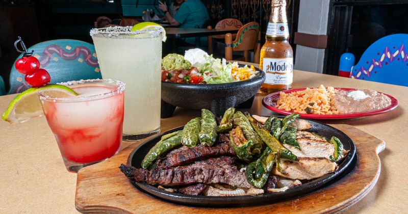 Chicken and beef fajitas, cocktails, beer and side dishes