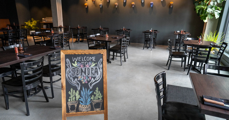 Tables ready for guests and a specials board