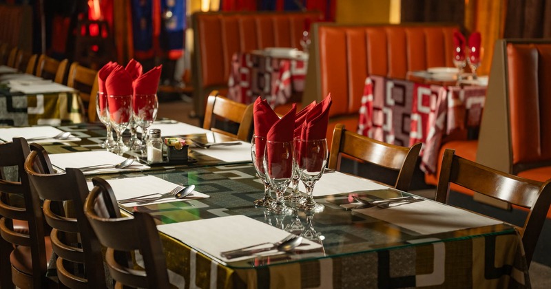 Interior, dining area with tables set for guests