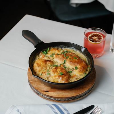 Rabbit and dumplings dish  paired with Pear of Eyes cocktail.
