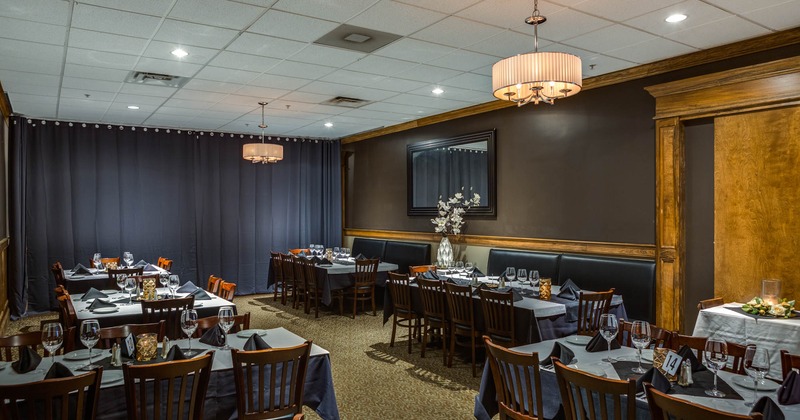 Elegant dining room with set tables, ready to receive guests