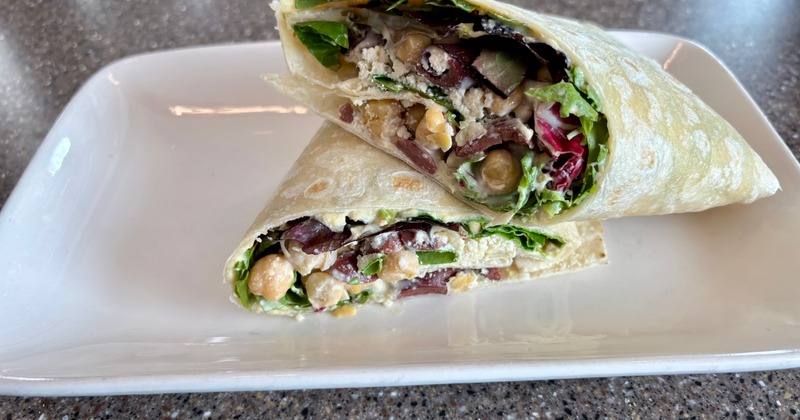 Mediterranean Wrap sliced in half and served