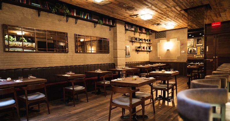 Interior, tables, chairs, booths, lighting, decorative mirrors, book shelves