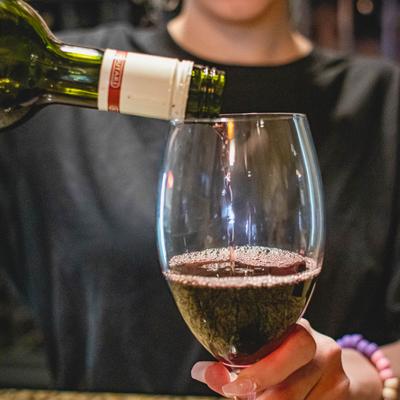 Bartender sipping wine