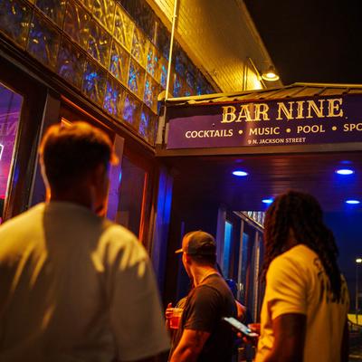 People crowding outside the entrance.