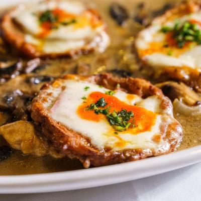 Chicken breast topped with eggplant, and cheese