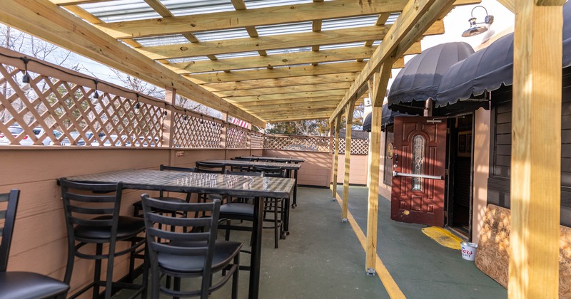 Outdoor covered seating area, tables and chairs