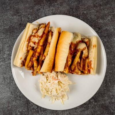 Grilled chicken sandwich, with American cheese, onions, alley fries, and a side of coleslaw.