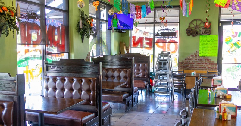 Interior, dining area, leather padded seating booths with wooden top tables
