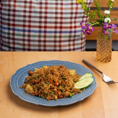 Pineapple Fried Rice with egg, carrots, green onions, cashew nuts and cucamber slices.