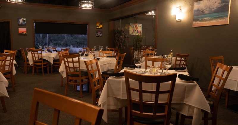 Dining area with many tables ready for guests