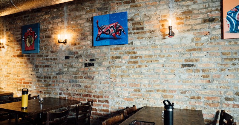 Interior,tables by a wall with artwork