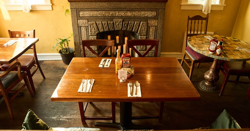 Interior, dining tables and fireplace