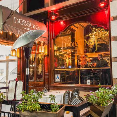 Restaurant entrance with outdoor seating.