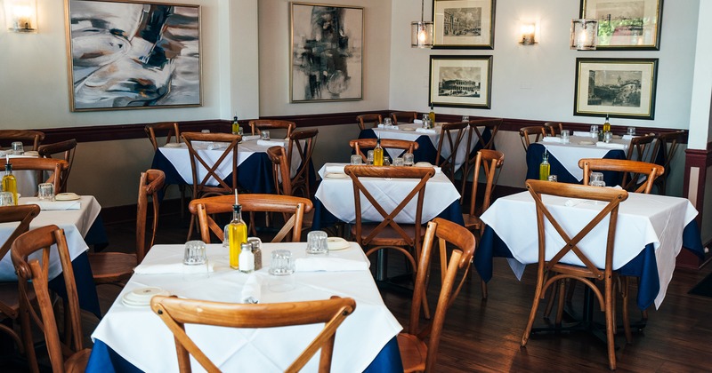 Restaurant interior, dining area with set tables