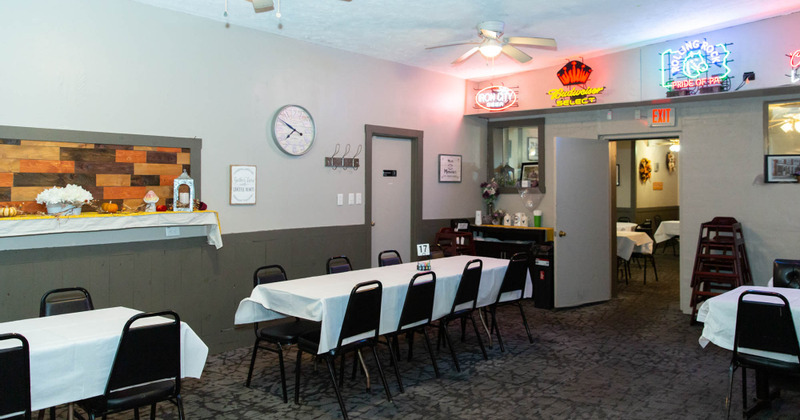 Interior, long tables in a room decorated with autumn details