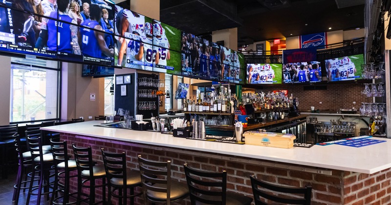 Bar, screens above, drink rack