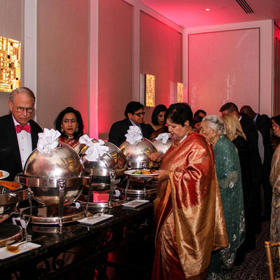 Two rows of people near the catering table