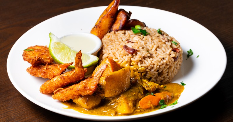 Coconut shrimp, curry chicken, rice, and plantains