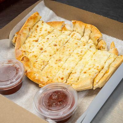 Cheese breadsticks in a box, accompanied by two small containers of marinara sauce.