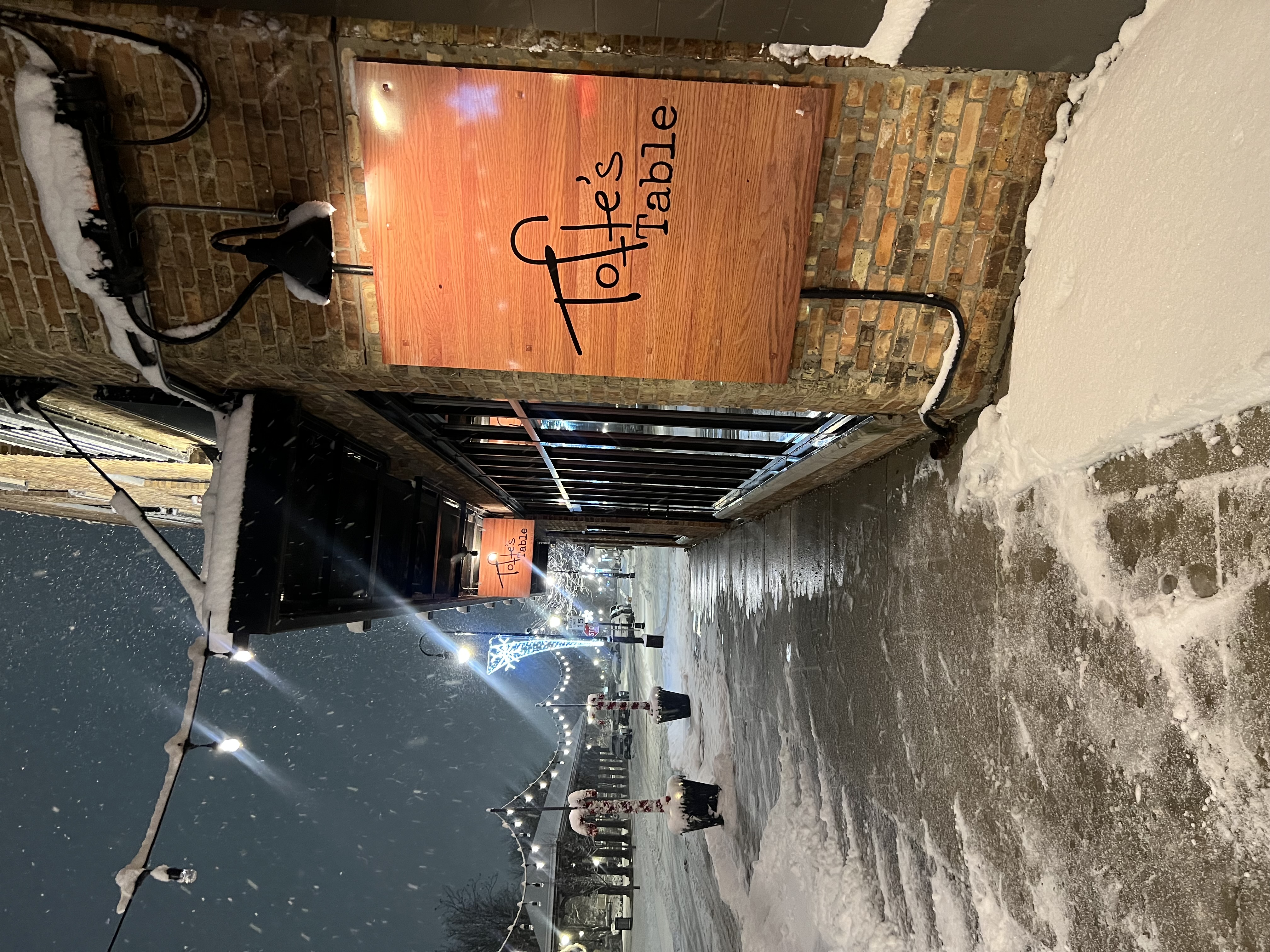 Picture of Tofte’s Table brick building with snowfall