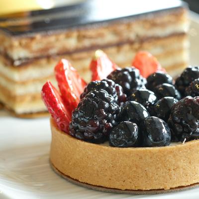 Tart topped with strawberries, blackberries and blueberries.