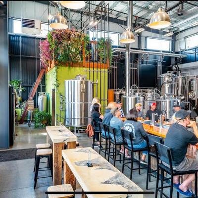 Customers sitting at the bar.