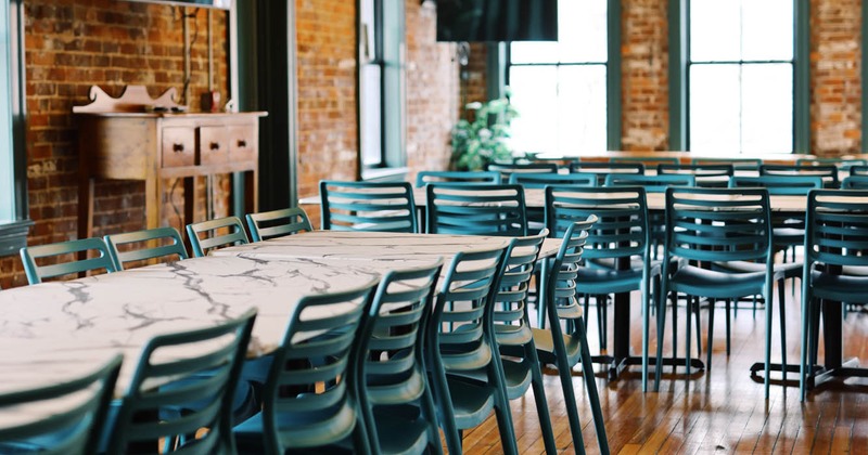 Lined up tables and chairs close up