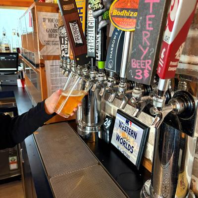Beer being poured from the tap into a pint glass.
