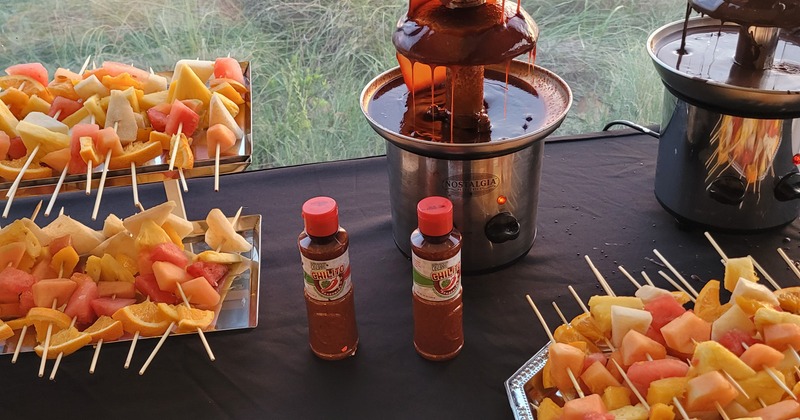 Chocolate fountains, skewered fruit and chili sauce