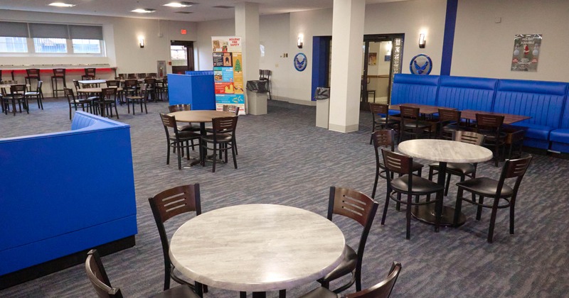 Interior with round tables and blue booths