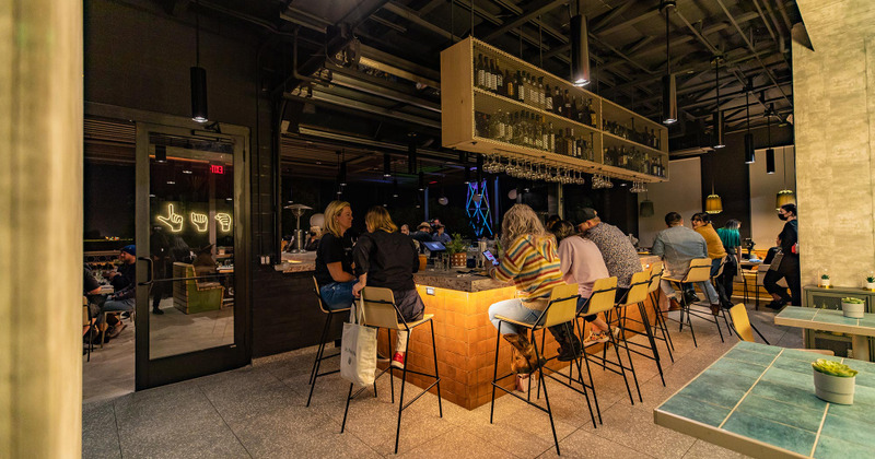 Customers sitting at bar counter