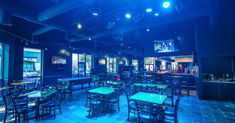 Spacious and cozy sports bar interior space, seating area
