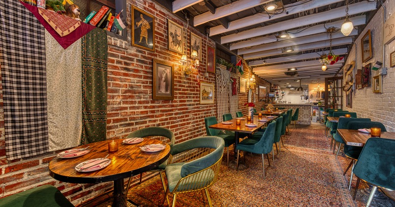 Cozy and stylish restaurant interior, narrow dining area with set dining tables