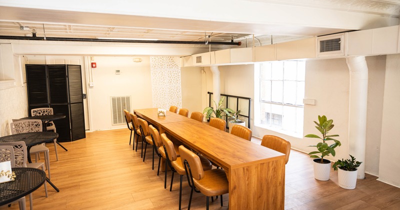 Interior, big wooden table ready for guests