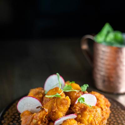 A dish with Spiced cauliflower, signature sauce, ginger and garlic emulsion