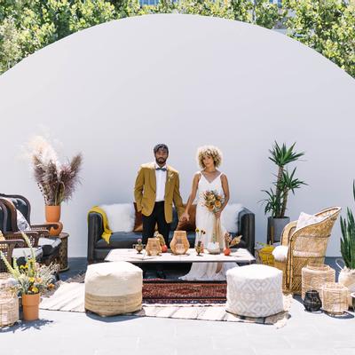 The bride and groom holding hands.