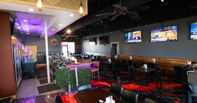 Seating area, TVs on the walls