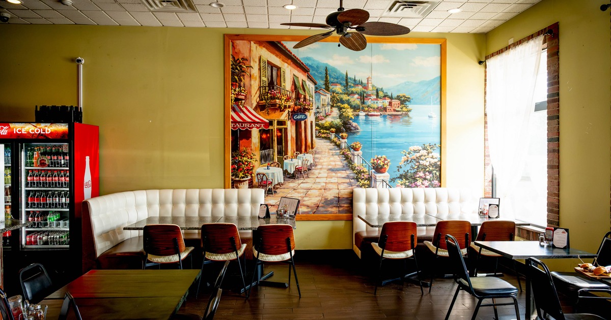 Interior with chairs, tables and white curved booth