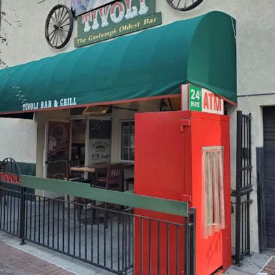 Exterior with entrance, sign, patio and  ATM security surround unit.